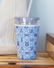 Tumbler with blue pattern on a wooden surface