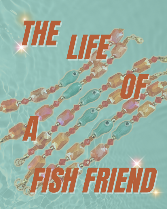 Text 'The Life of a Fish Friend' with fish-themed jewelry on a light blue background