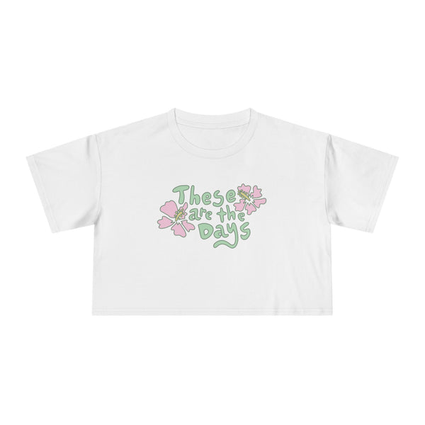 White t-shirt with floral design and text on a white background