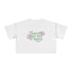 White t-shirt with floral design and text on a white background