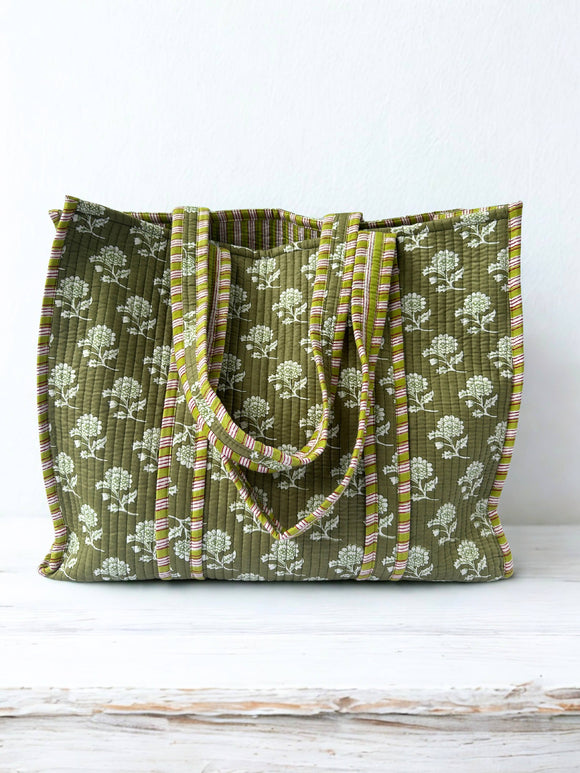 Green floral-patterned tote bag on a white background