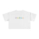 White t-shirt with colorful designs on a white background